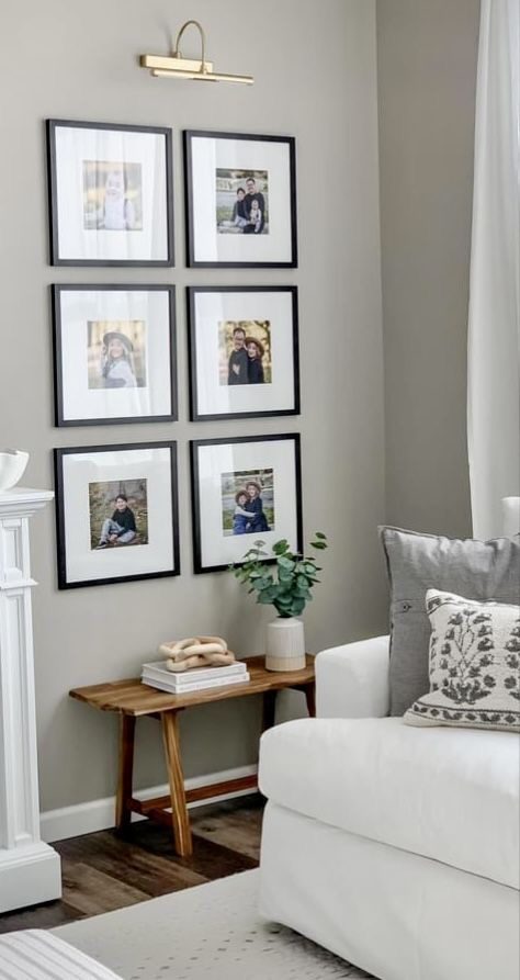 Black-Framed Photos Above a Slim Wooden Bench