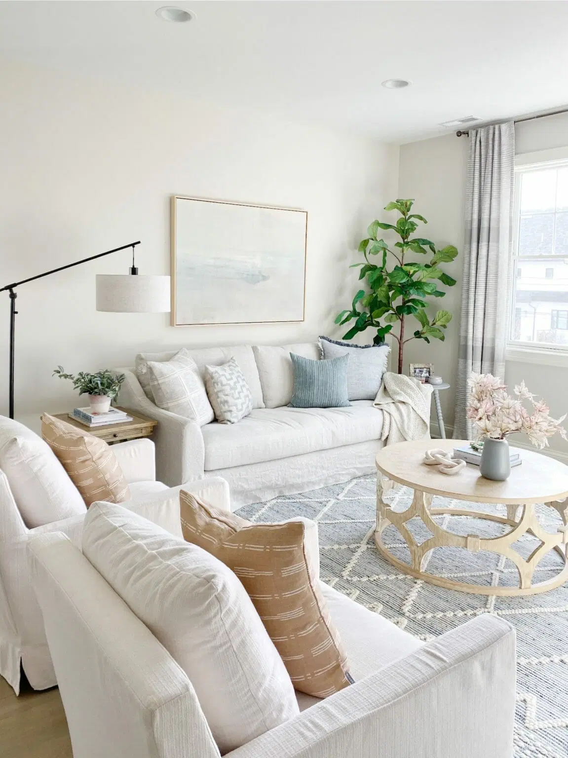 Oversized Artwork Creates a Serene Focal Point Above the Sofa