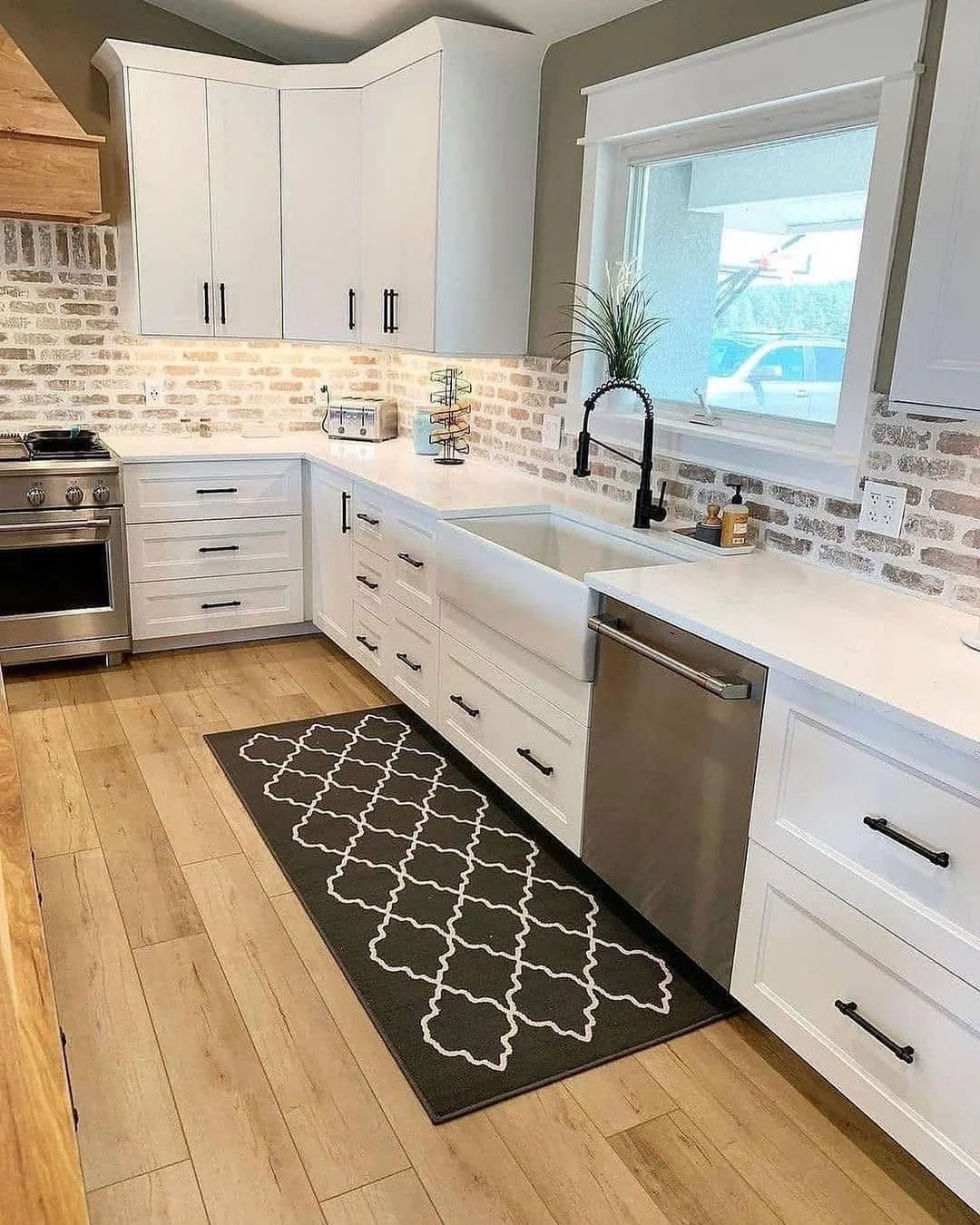 Distressed Brick Meets Sleek Black Hardware