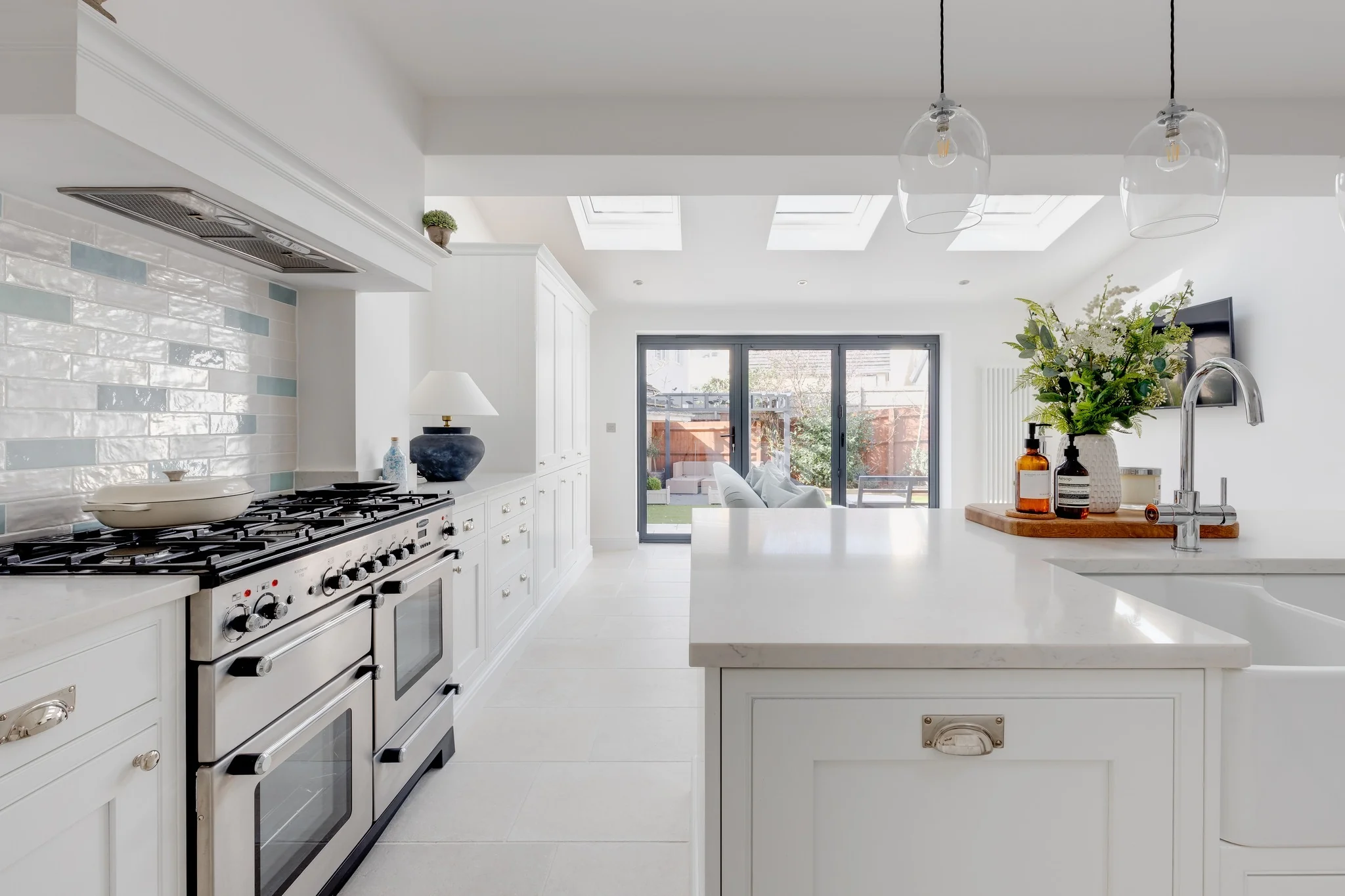 Subtle Blue Accents on a White Brick Backsplash