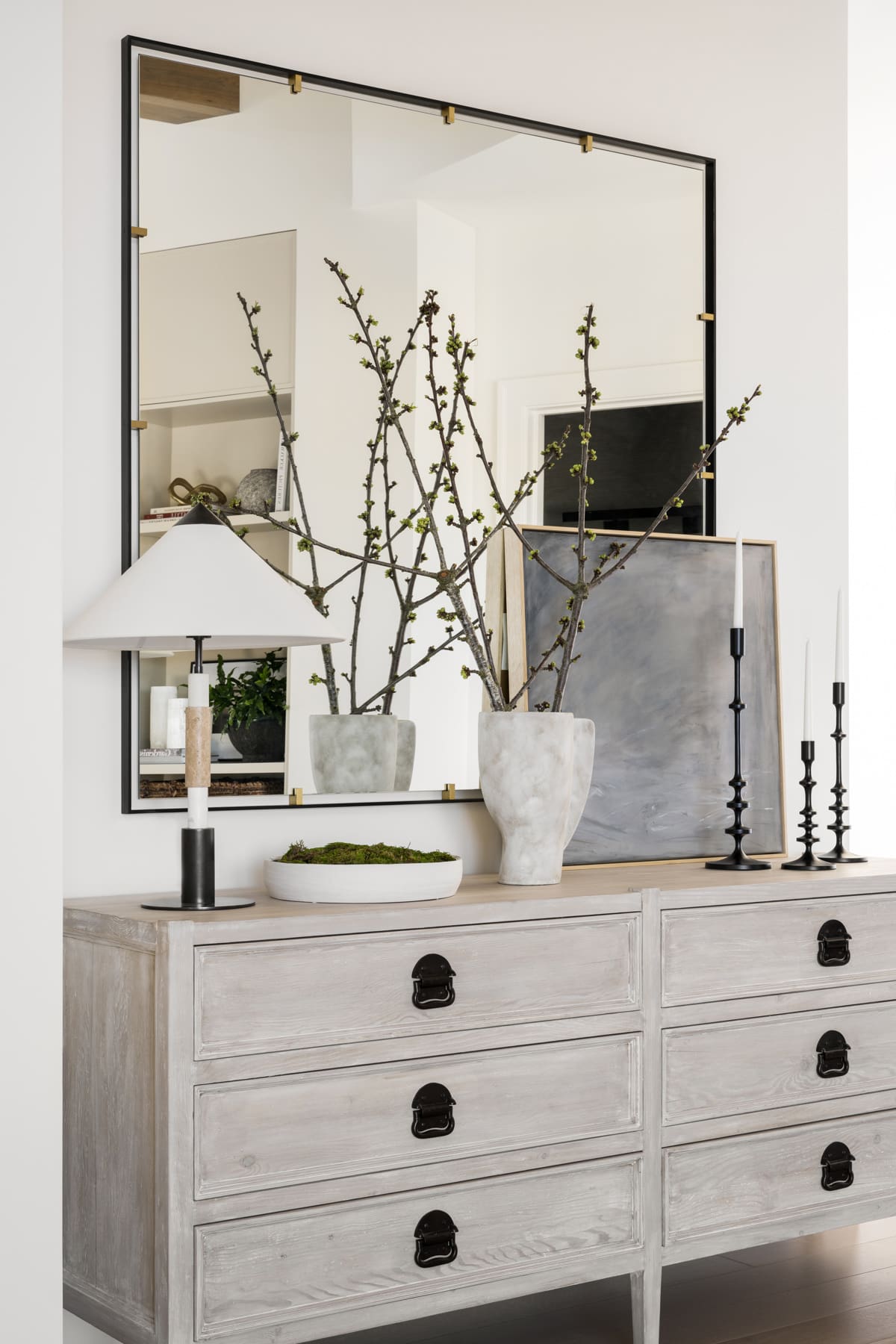 Tall Black Candlesticks Add Vertical Drama to Console Display