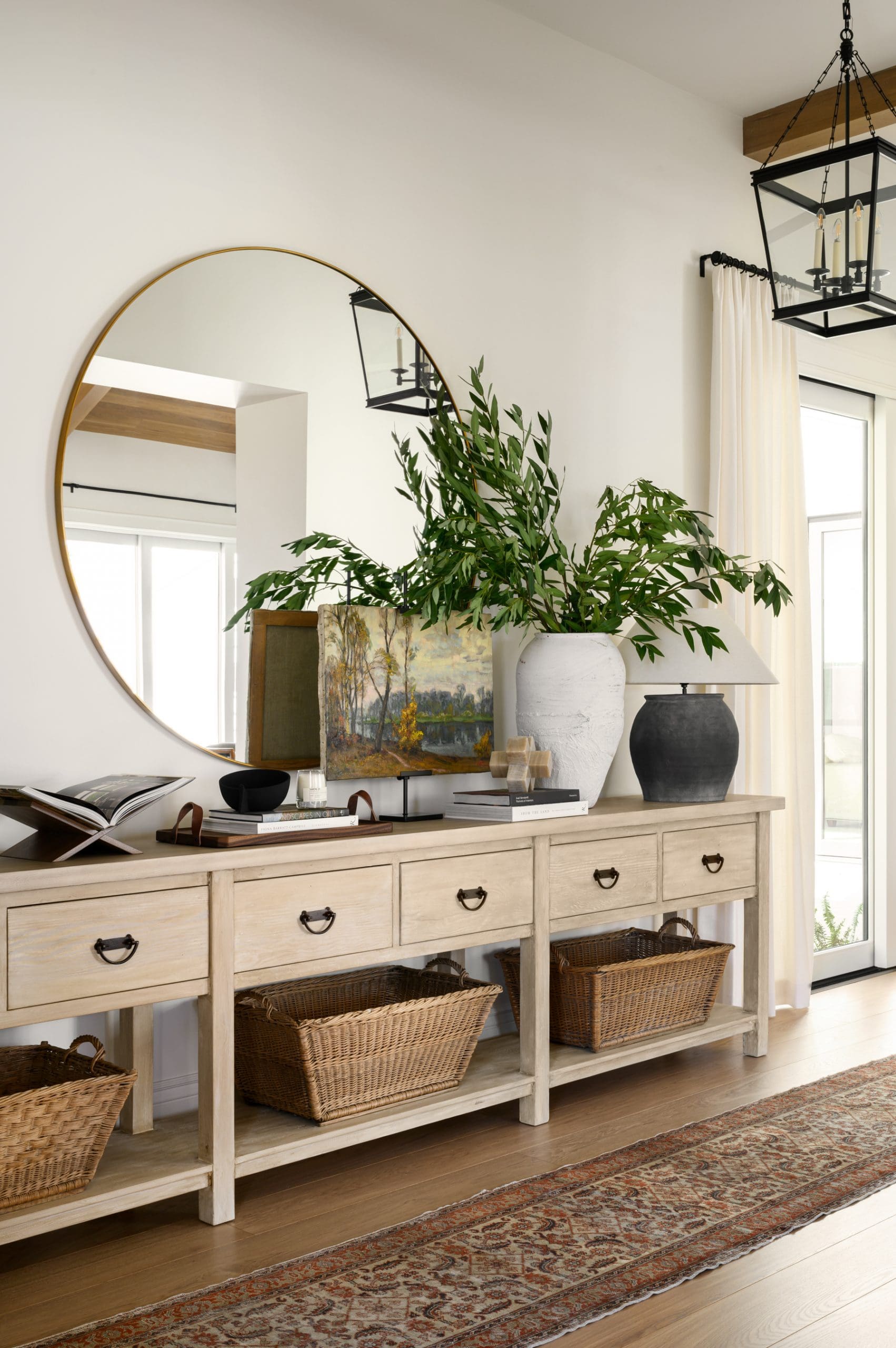 Wooden Console Holds Woven Baskets for Cozy Entryway Storage
