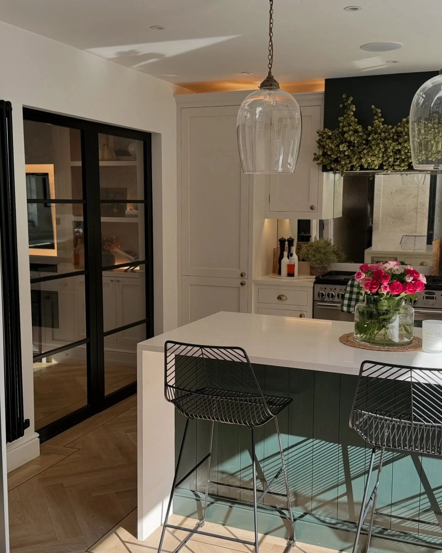 Frame a Greenery Display with Statement Pendant Lights