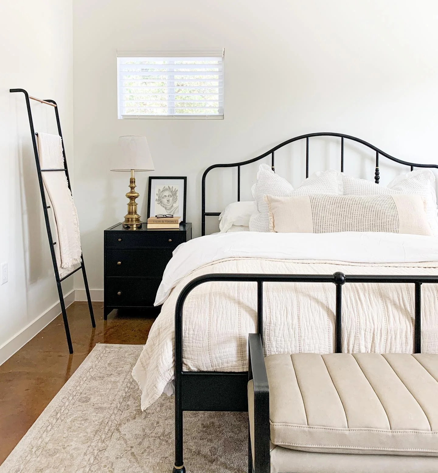 Black Metal Ladder Holds Throws for Cozy Texture