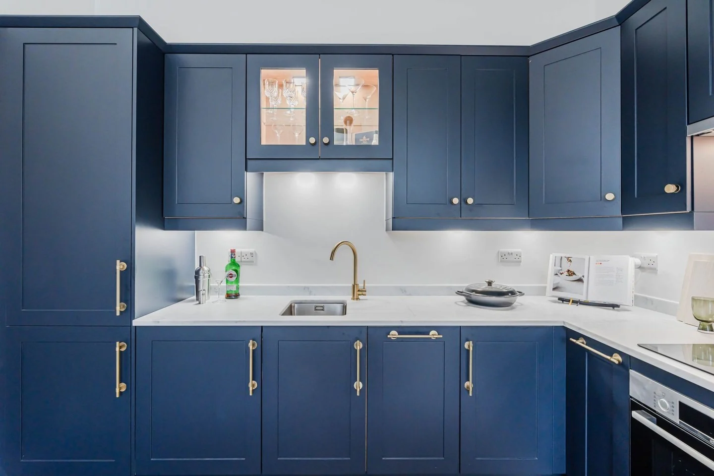 Glass-Fronted Cabinets Display Barware with Warm Interior Lighting