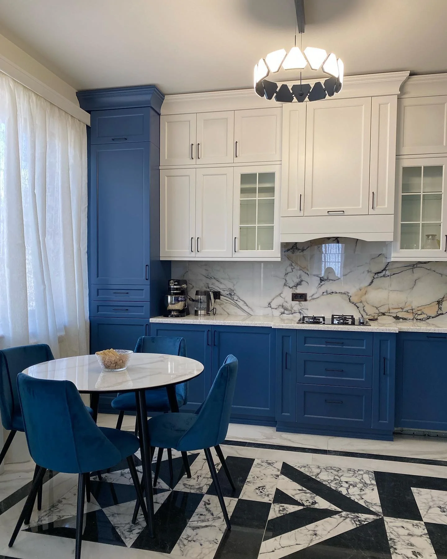Pair Bold Blue Cabinets with a Dramatic Marble Backsplash