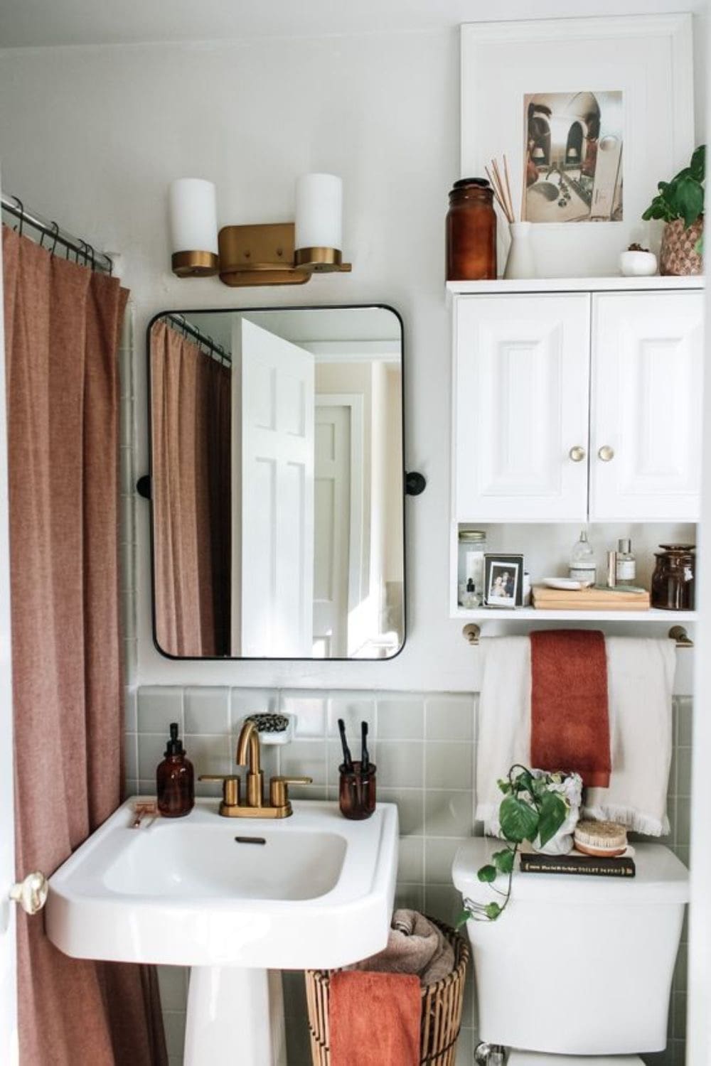 White Wall Cabinet Adds Open and Closed Storage Above Toilet