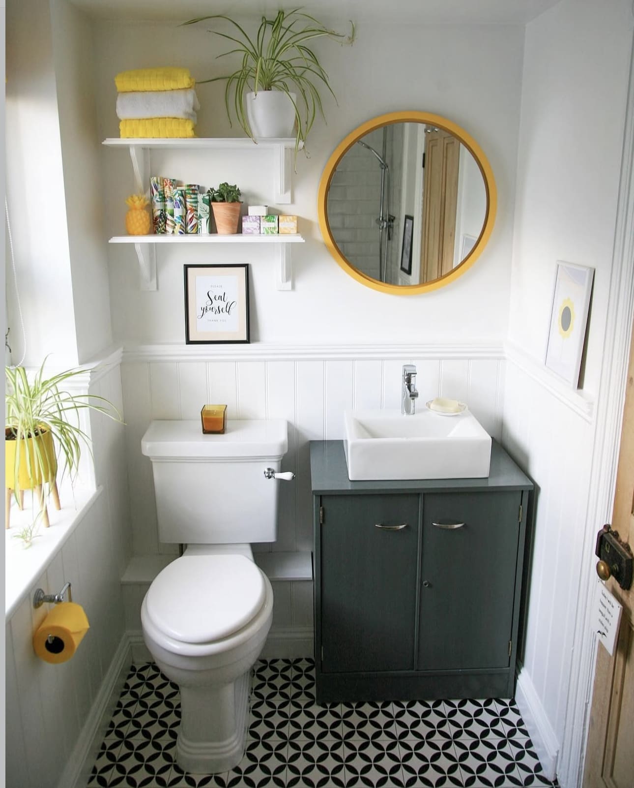Yellow Round Mirror Adds a Cheerful Pop Above the Vanity