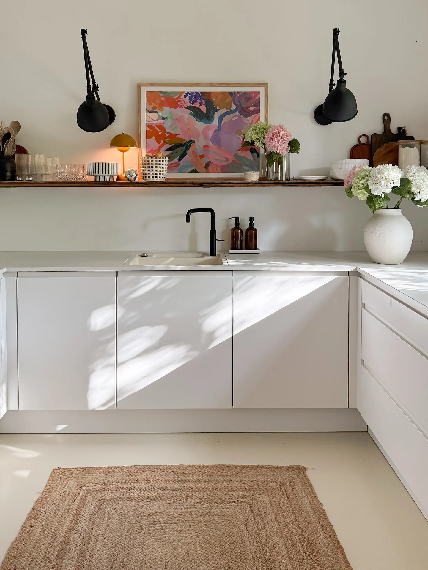 Artistic Print Adds a Vibrant Focal Point Above Cabinets