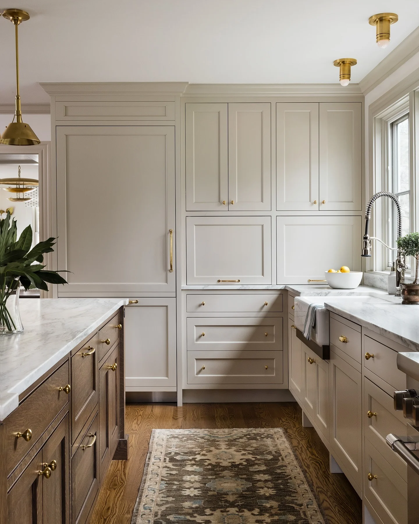Warm Wood Island Pairs with Light Gray Perimeter Cabinets