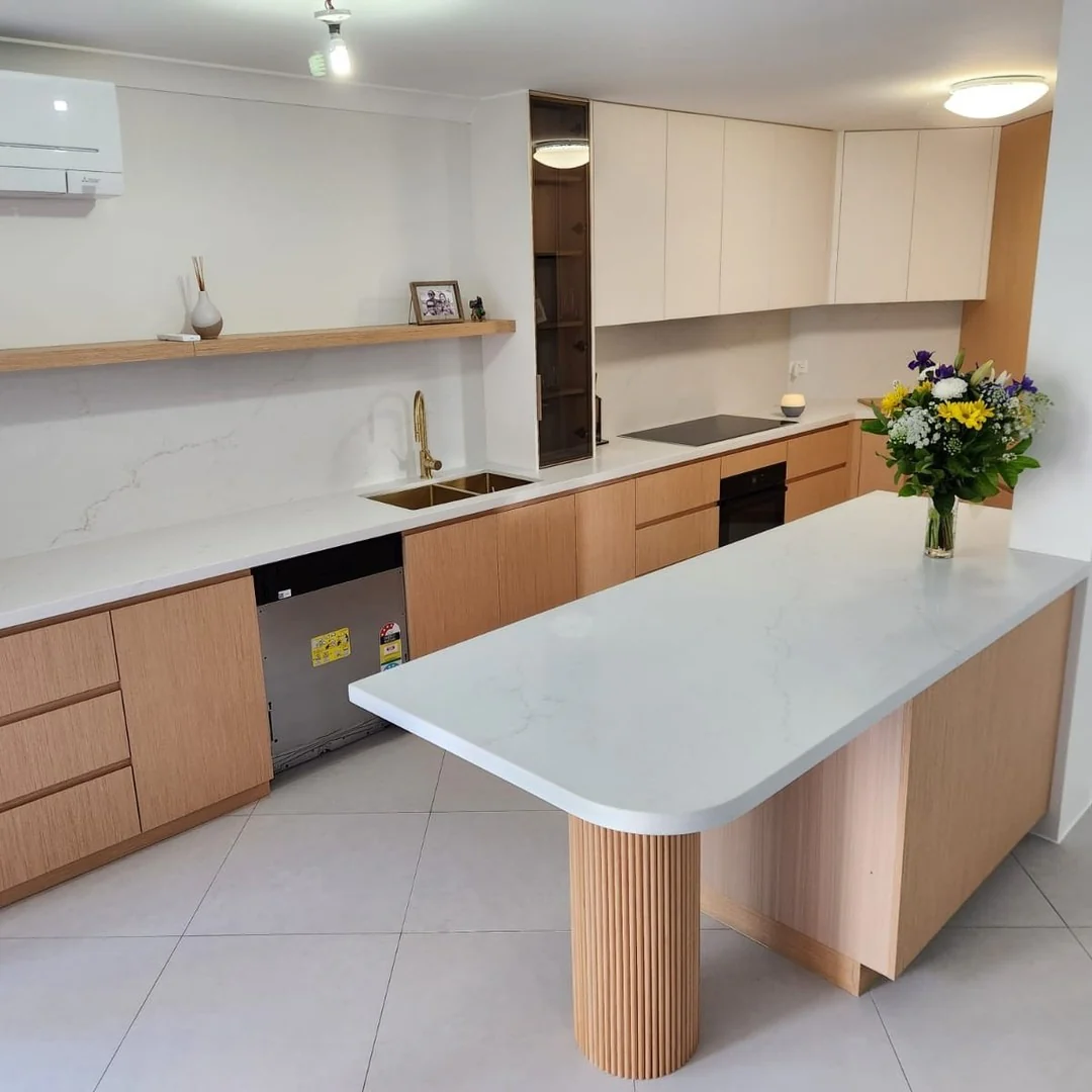 Fluted Wood Pedestal Supports Island Countertop