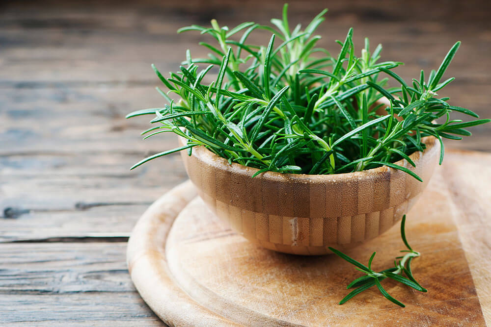 Bamboo Bowl With Fresh Rosemary Sprigs