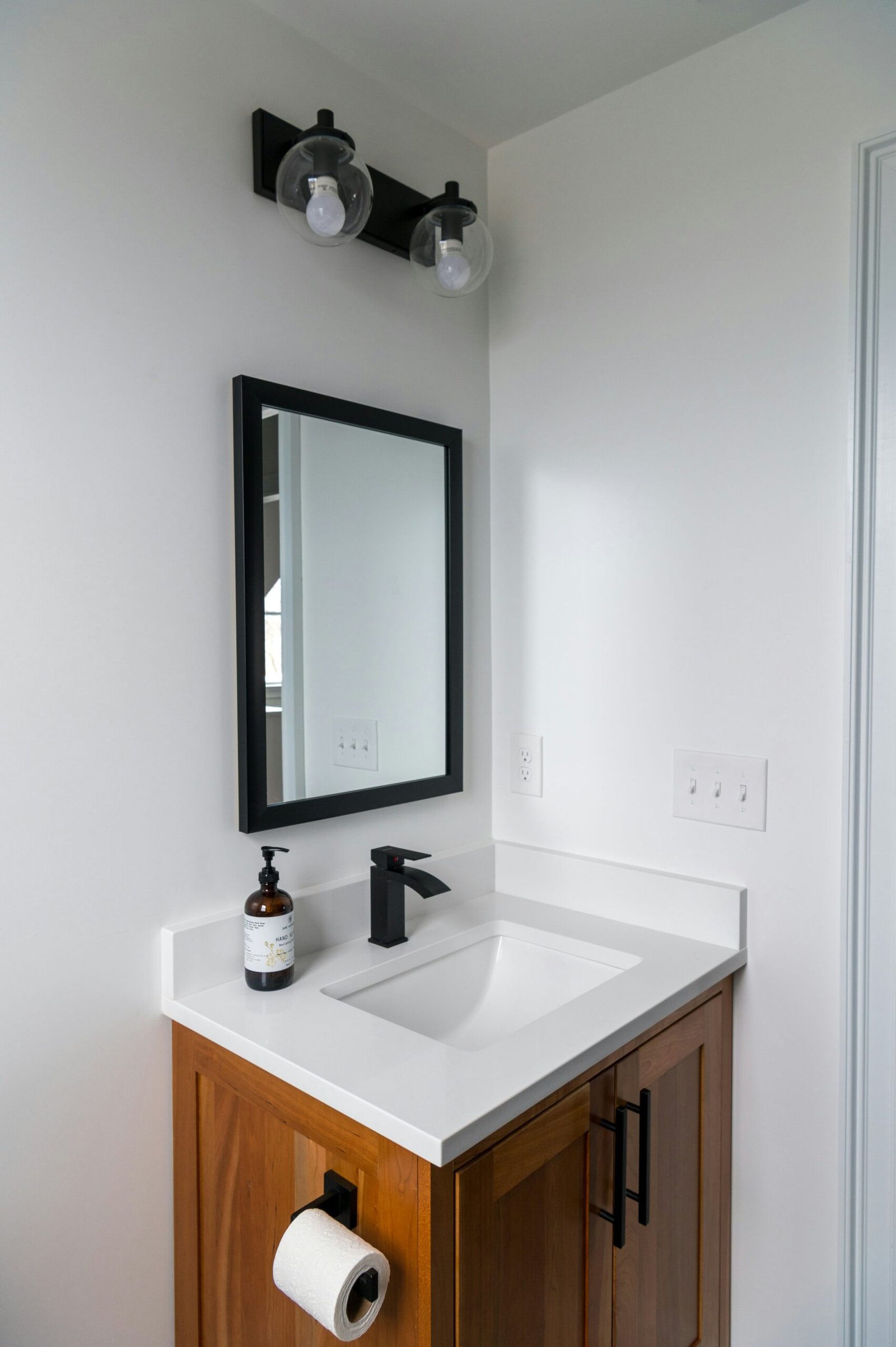 Black Globe Vanity Light Adds Industrial Touch