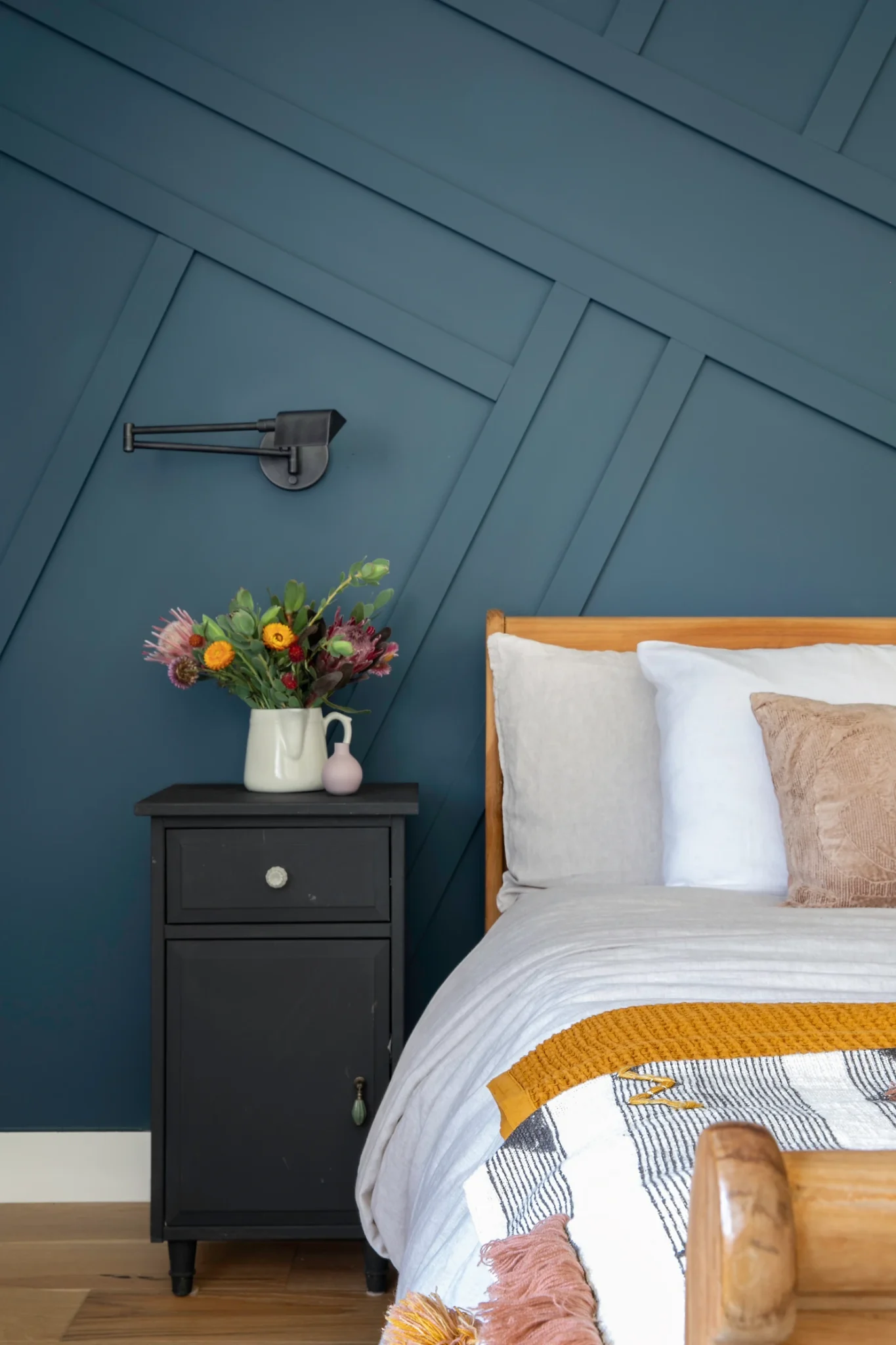 Geometric Paneling Adds Architectural Interest Behind Bed