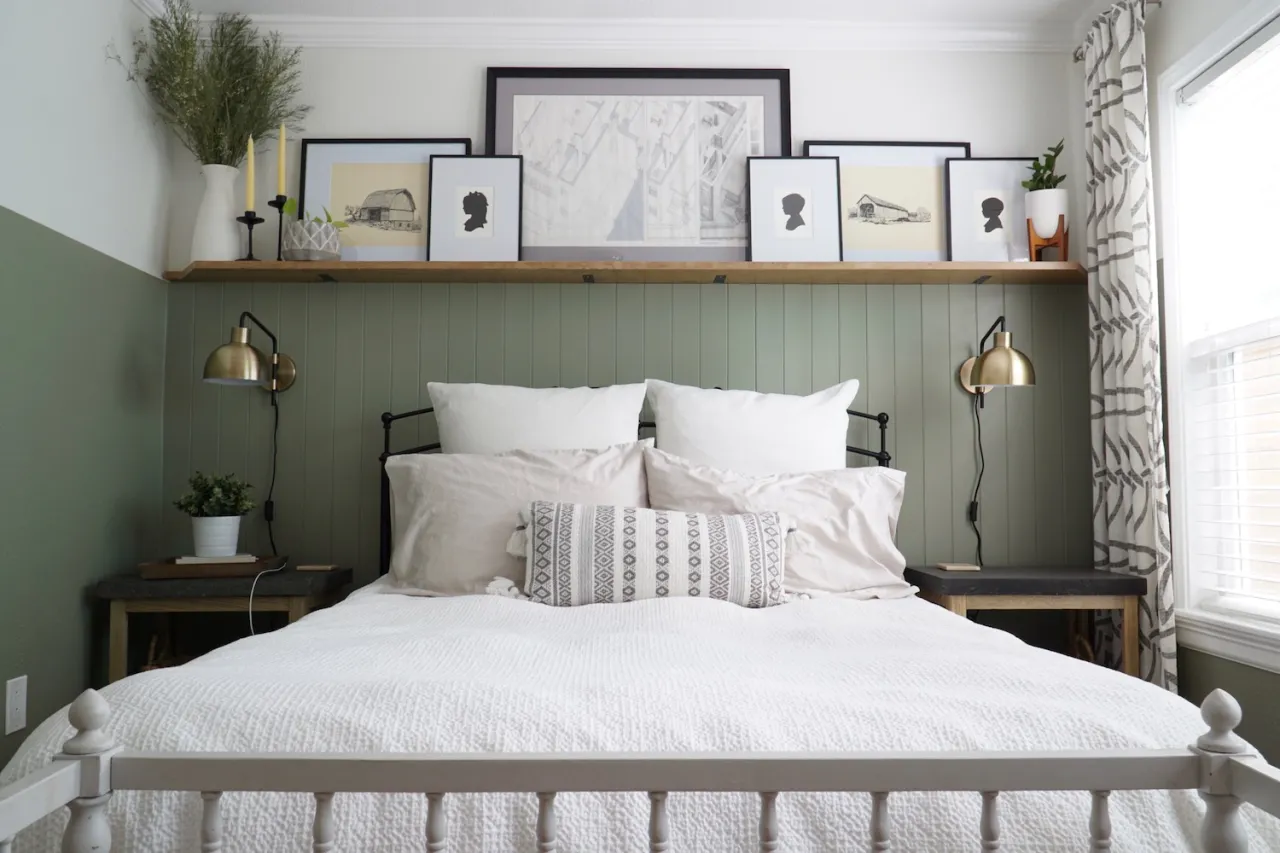Layered Shelf Displays Above a Paneled Bed Wall
