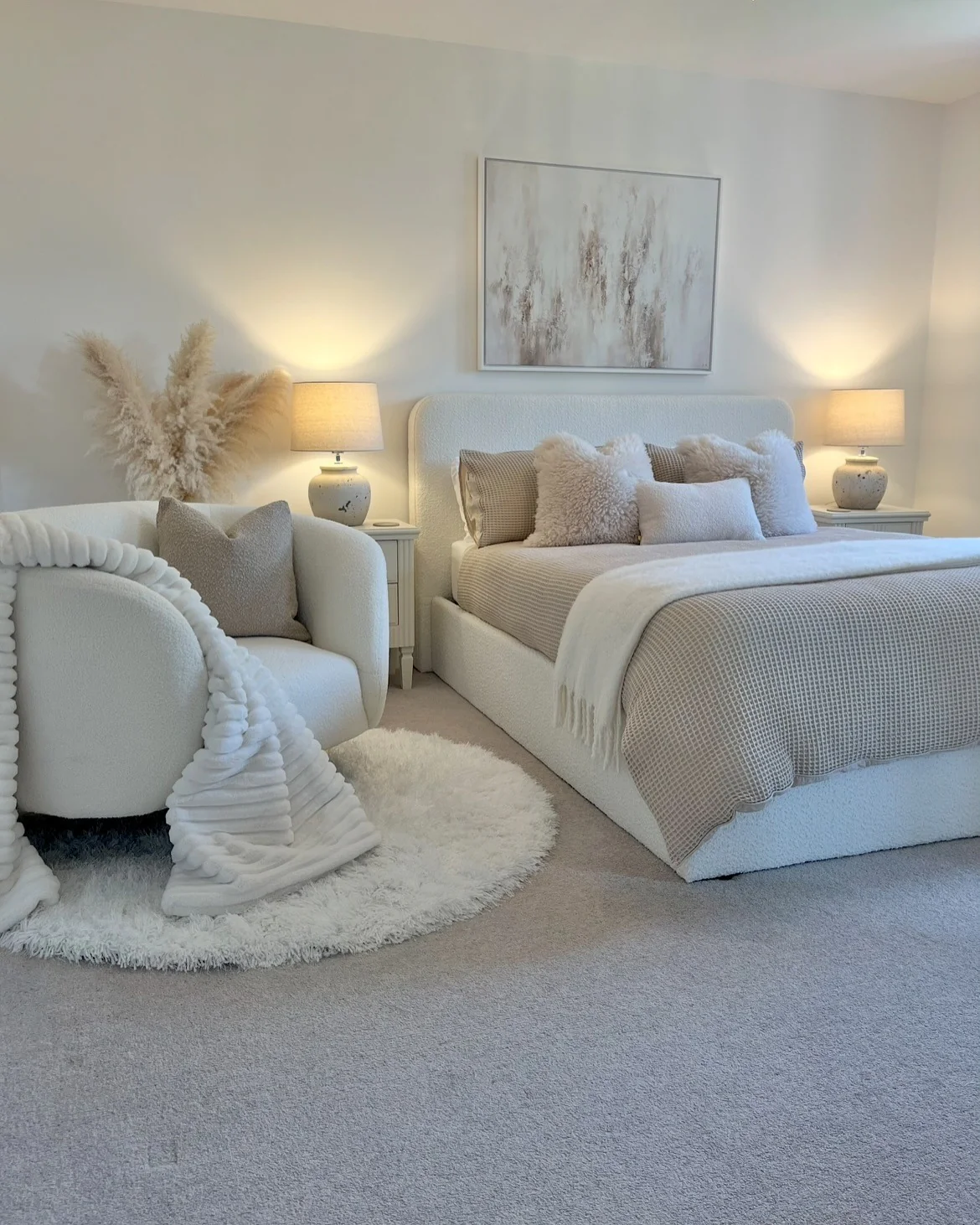 Round Shaggy Rugs Add Softness Beside a Bouclรฉ Bed
