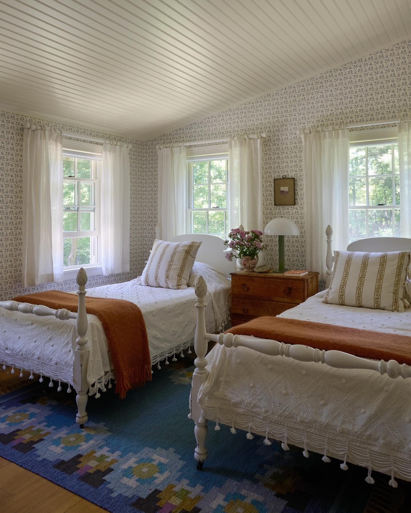 Inject Color with a Geometric Rug Between Twin Beds
