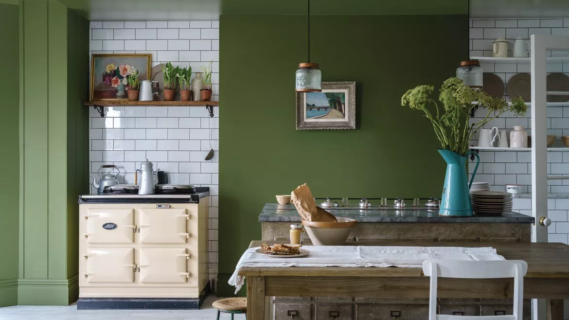 Olive Green Accent Wall Grounds a Cream Kitchen