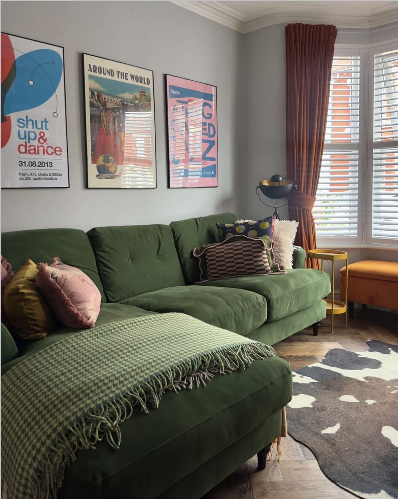 Three Framed Posters Add Graphic Punch Above the Sofa
