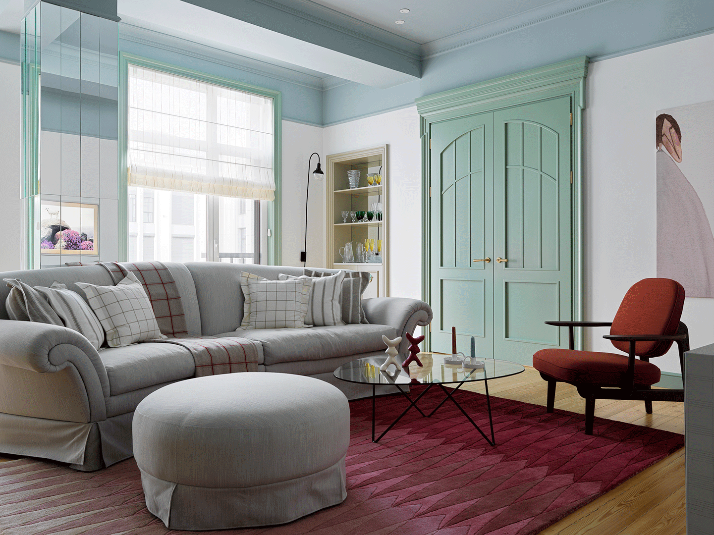 Soft Grey Sofa With Patterned Pillows and Plaid Accents