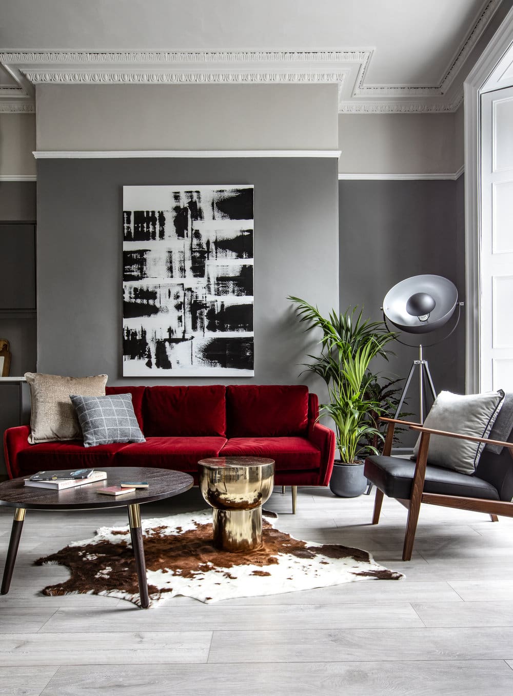 Bold Abstract Art Anchors a Rich Red Sofa
