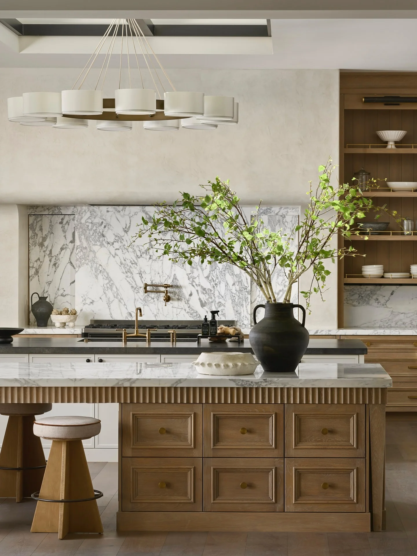 Large Black Vase with Greenery Adds an Organic Touch to the Island