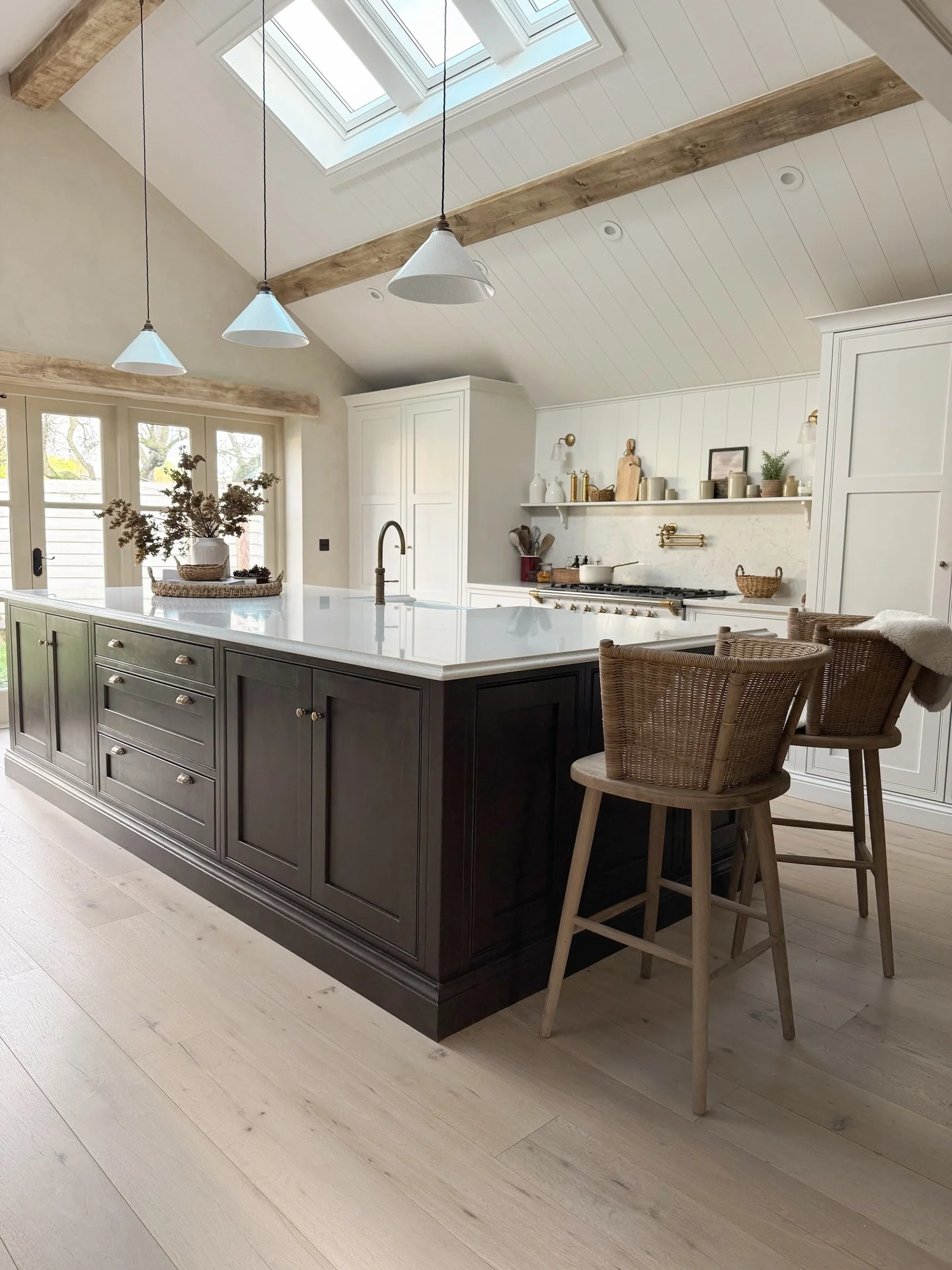 Dark Wood Island Anchors the Space with Rich Tones