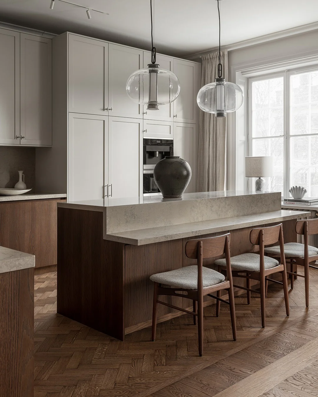 Clear Glass Lantern Pendants Define Island Seating