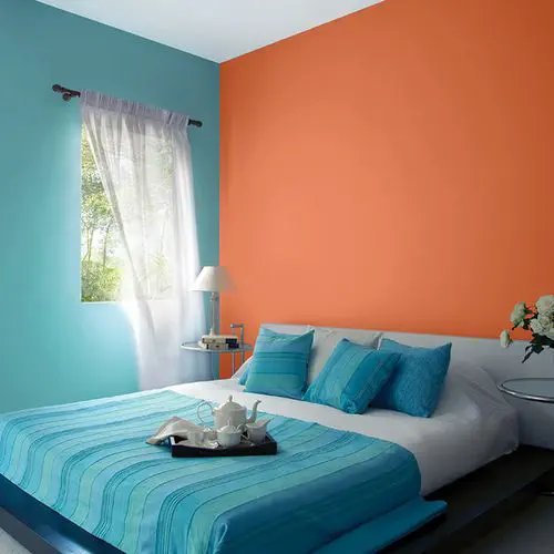 Orange and Teal Walls Create a Bold Bedroom Contrast