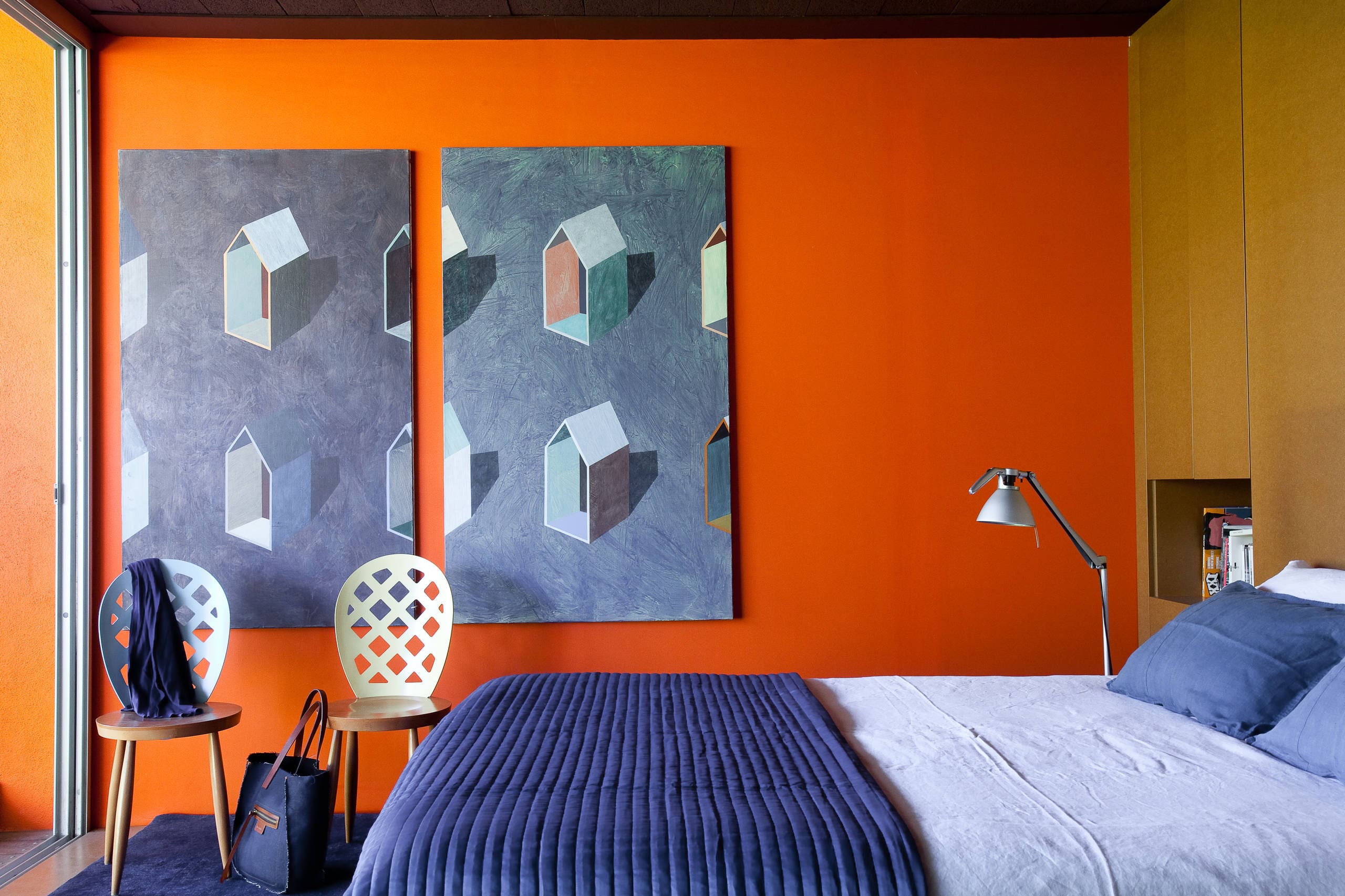 Orange Walls With Geometric Art Create a Bold Bedroom Backdrop