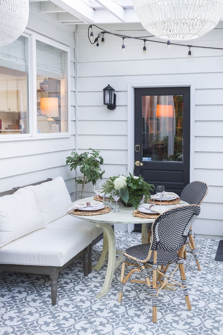 Monochromatic Stenciled Patio Floor Defines Dining Area