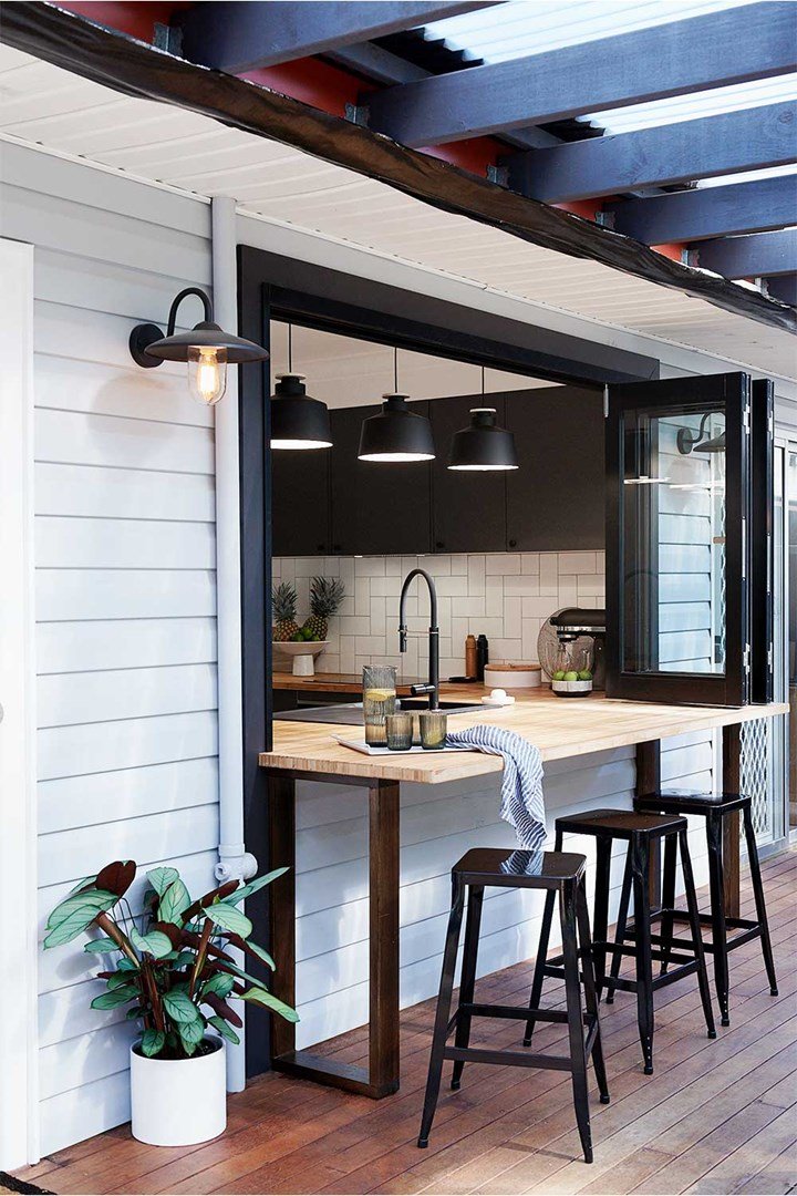 Countertop window creates a seamless indoor-outdoor kitchen flow