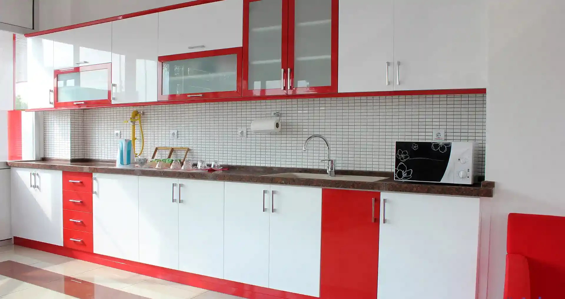 Crisp White Cabinets Frame Bold Red Drawer Fronts