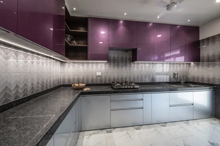 High-Gloss Purple Upper Cabinets Contrast With Matte Silver Base Units