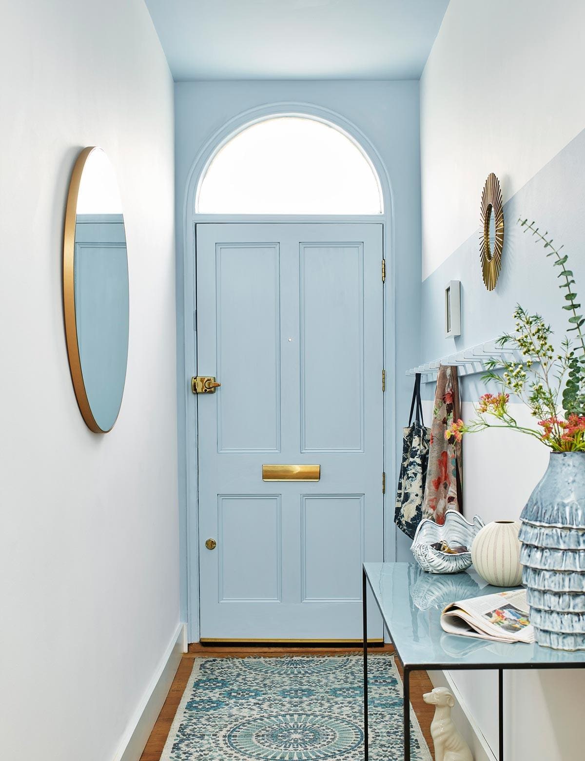 Pale Blue Door and Archway Frame the Entryway