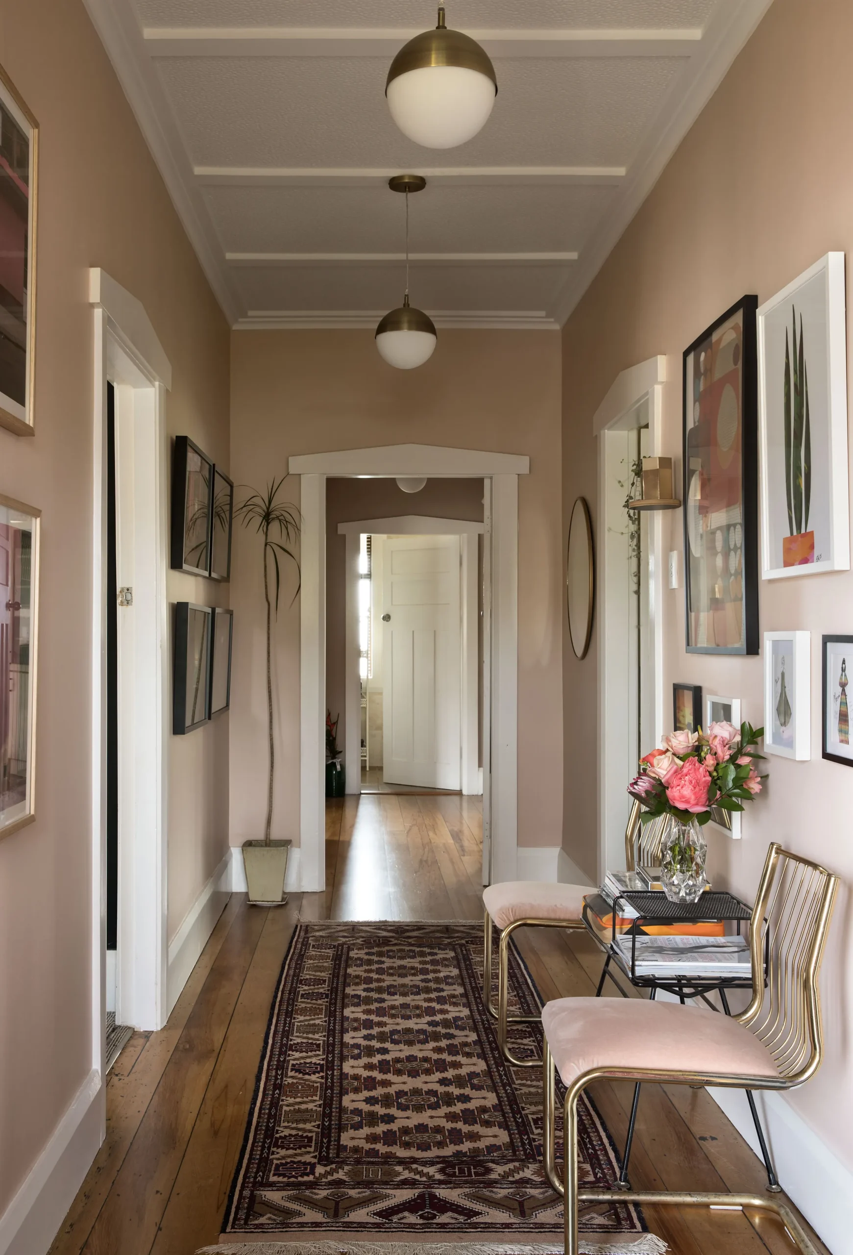 Pale Rose Walls Set Off Bold Art and Brass Accents