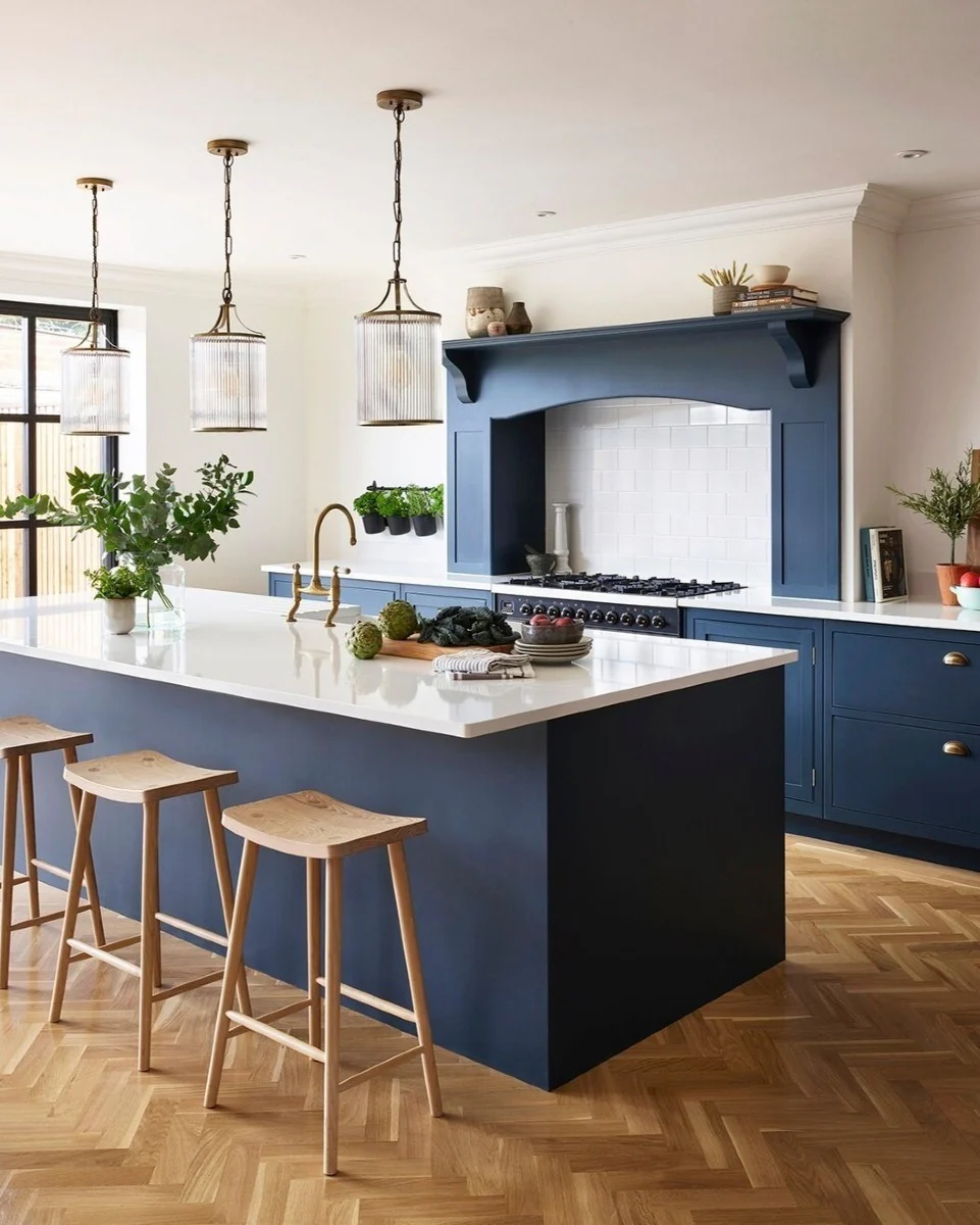 White Countertops Make a Deep Blue Island Pop