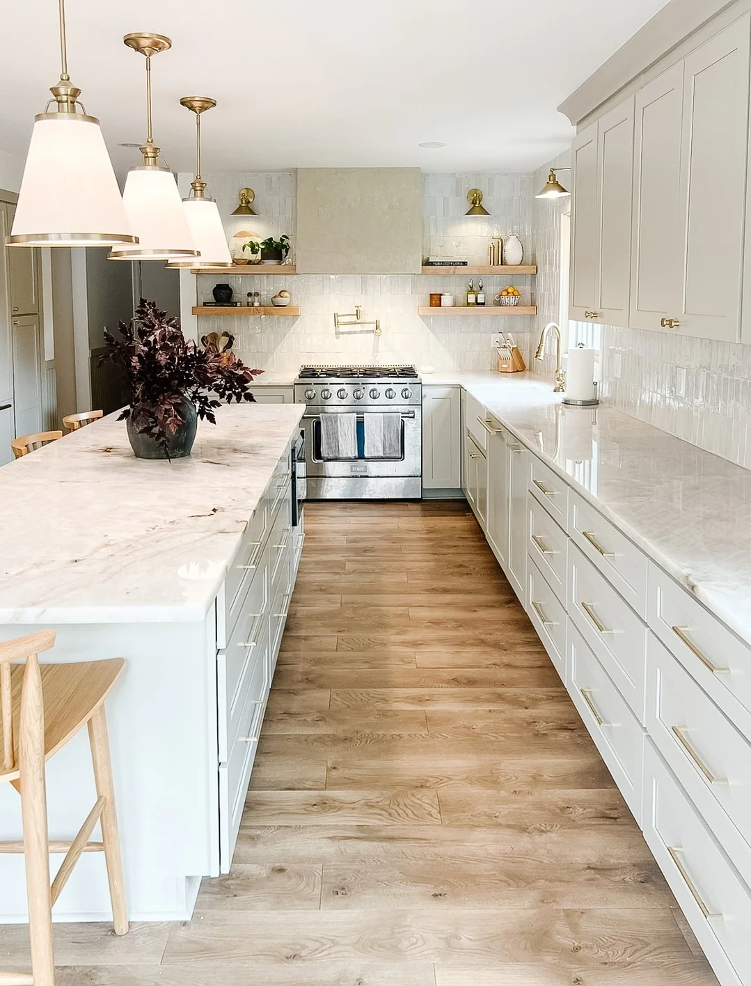 Warm Wood Floors Complement White Kitchen