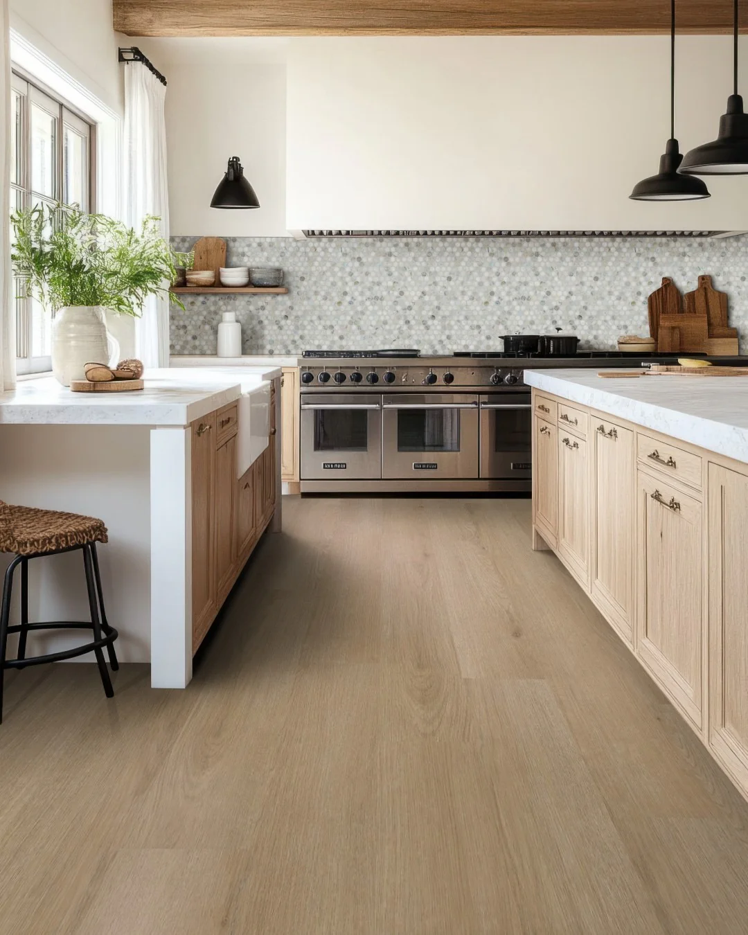 Light Wood Cabinets Frame White Countertops With Subtle Hardware