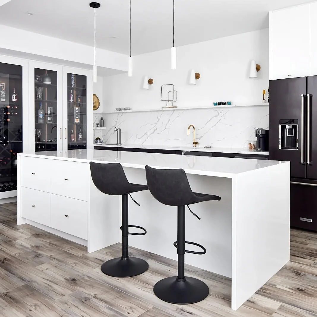 Minimalist Waterfall Island with Black Bar Stools