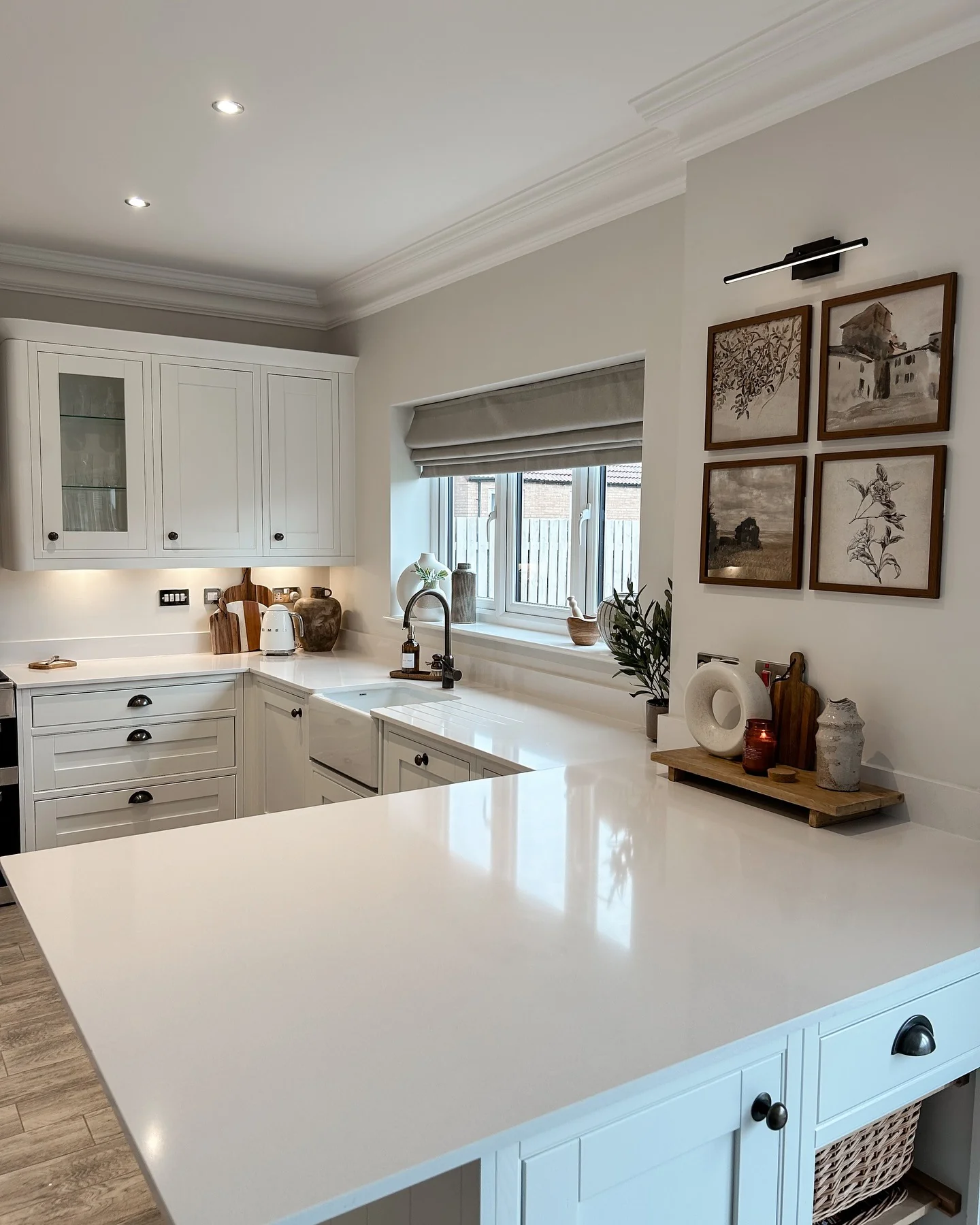 Farmhouse Sink and Dark Fixtures Ground White Quartz