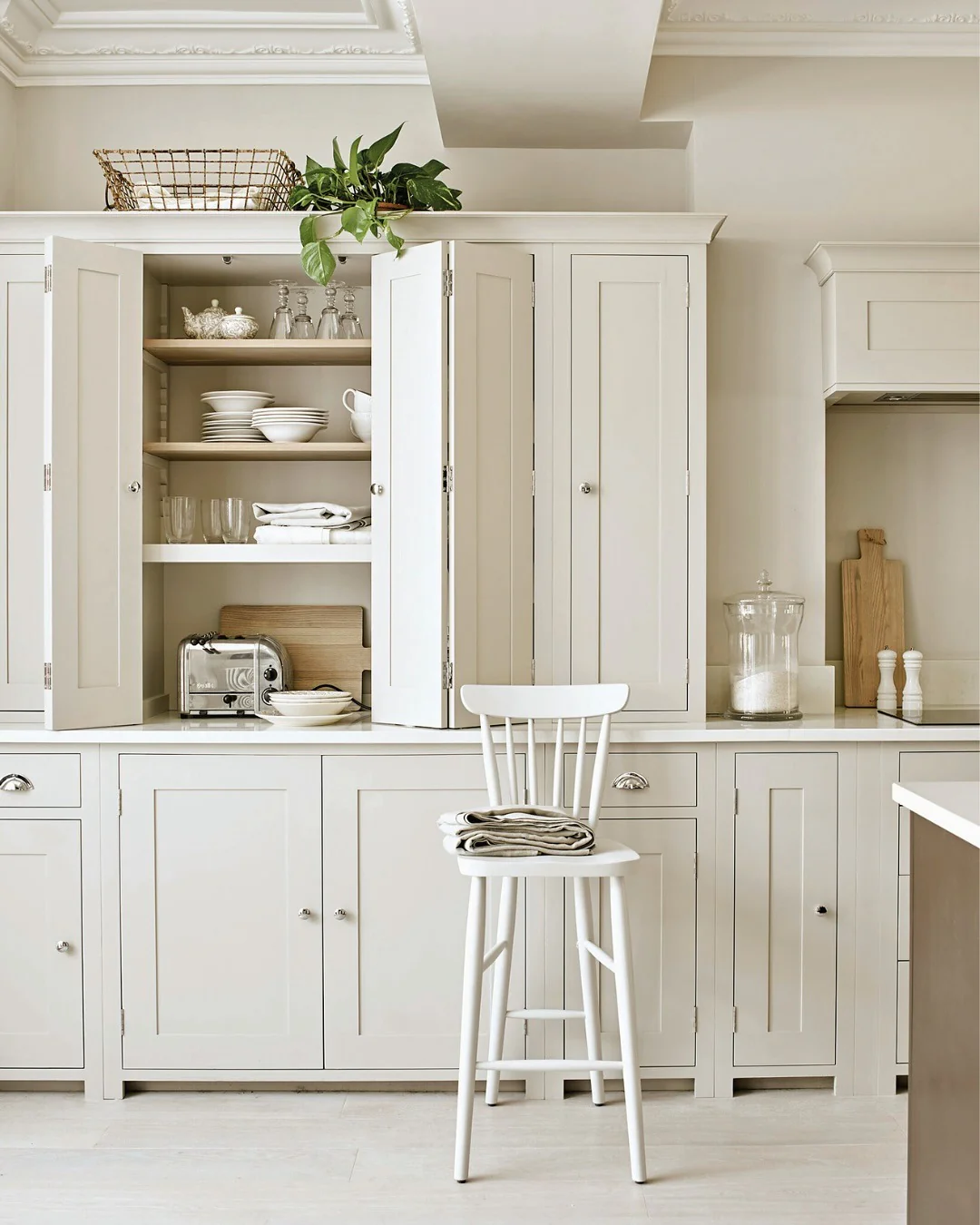 Open Shelving With Elegant Glassware and White Dishes