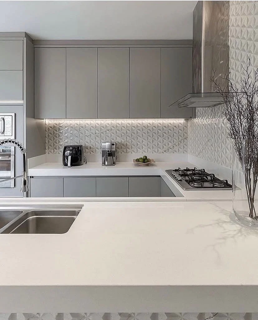 Textured Backsplash Adds Dimension Behind White Counters