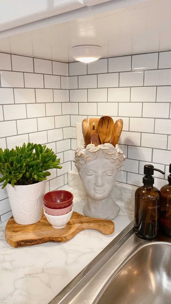 Sculptural Bust Holds Utensils for a Classical Touch