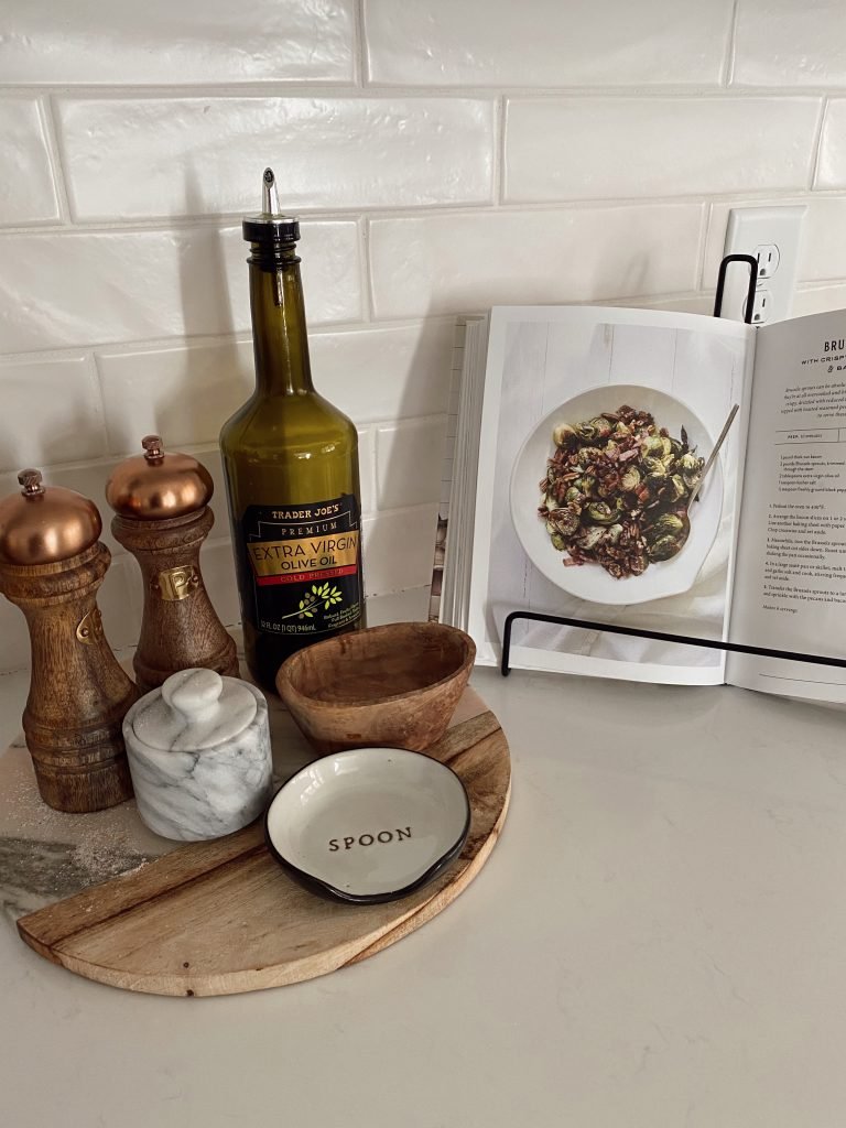Group Small Kitchen Essentials on a Marble and Wood Tray