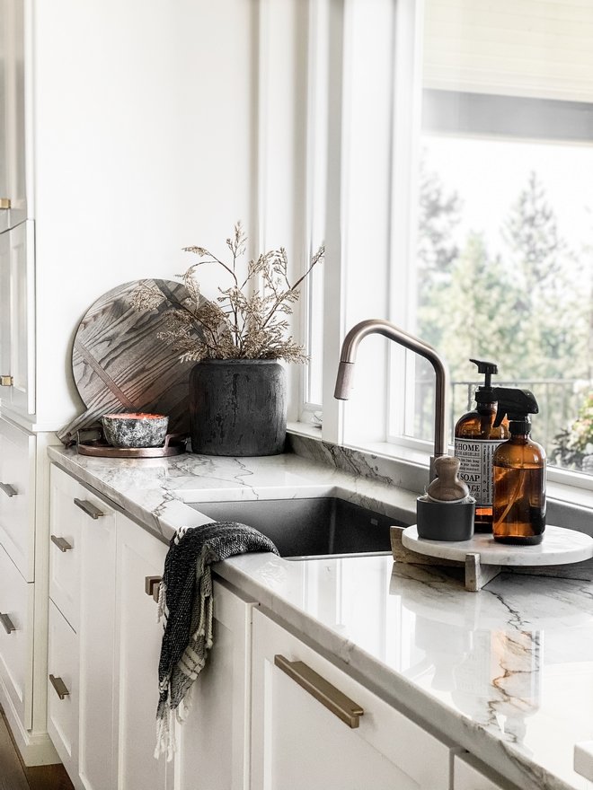 Style Your Sink Area with Amber Glass Bottles on a Riser