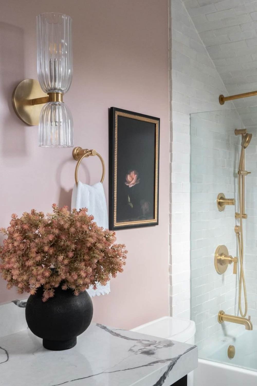 Fluted Glass Sconce Adds Soft Illumination to Pink Walls