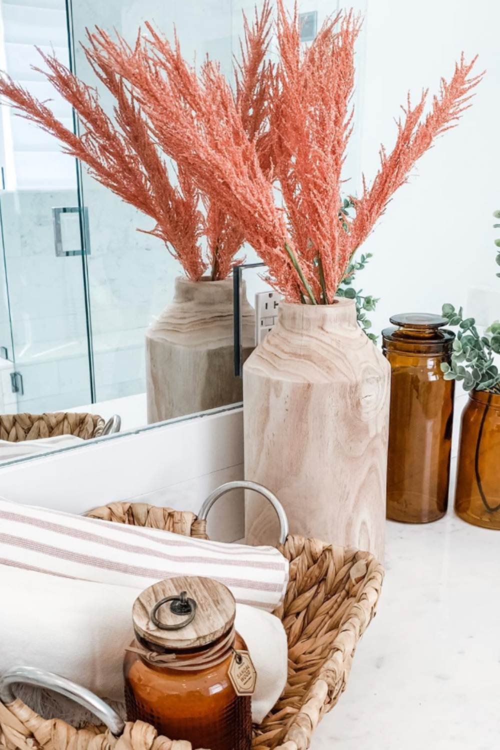 Natural Wood Vases Hold Fluffy Coral Grass