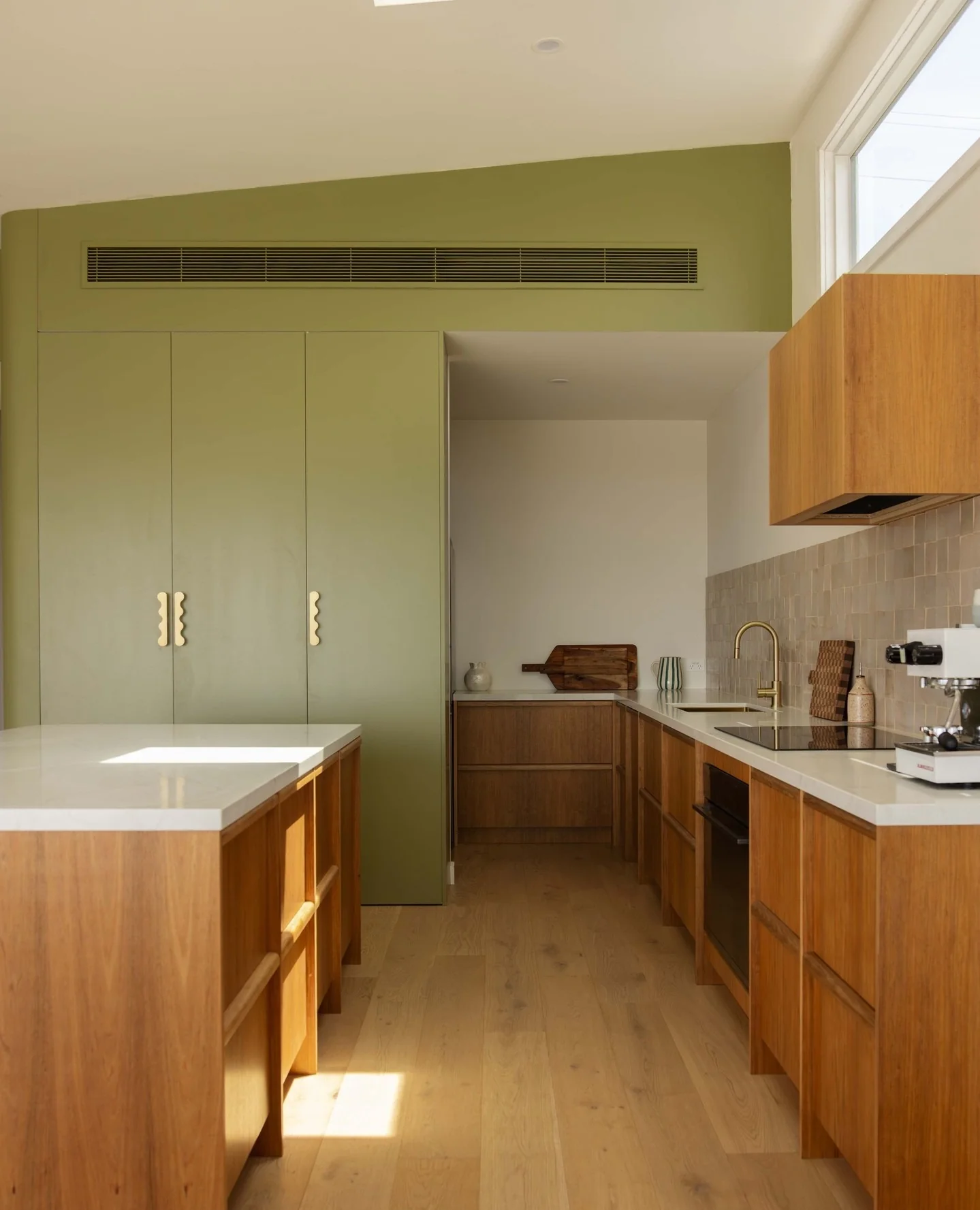 Scalloped Brass Pulls Add a Playful Touch to Sage Green Cabinets