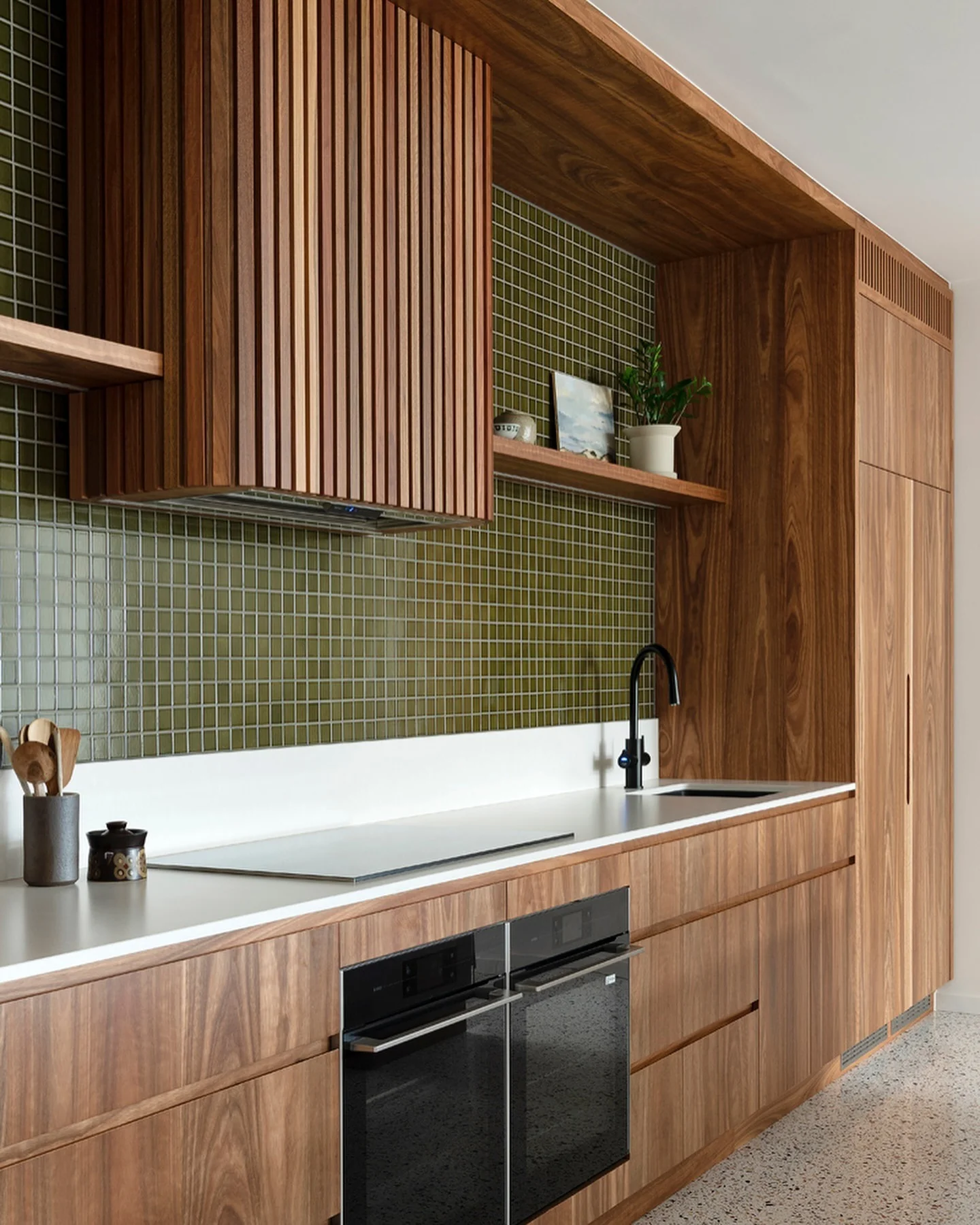 Vertical Wood Slats Conceal Range Hood for a Streamlined Look